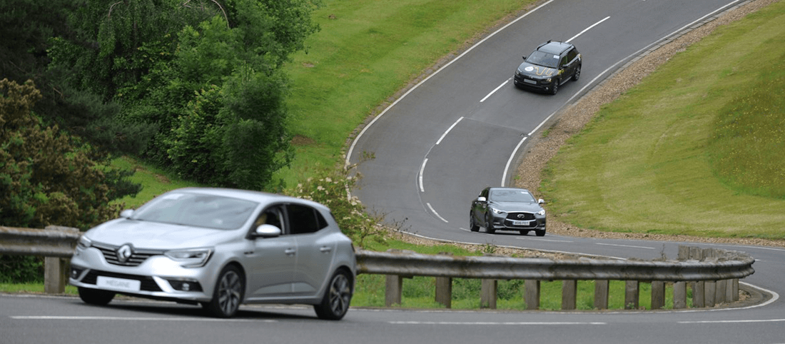 Renault Megane driving on gradient on Alpine Route