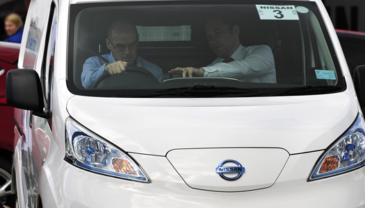 Manufacturer representative and driver talking in Nissan van
